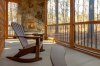 not-today-cabin-exterior-side-porch-adirondack-chair